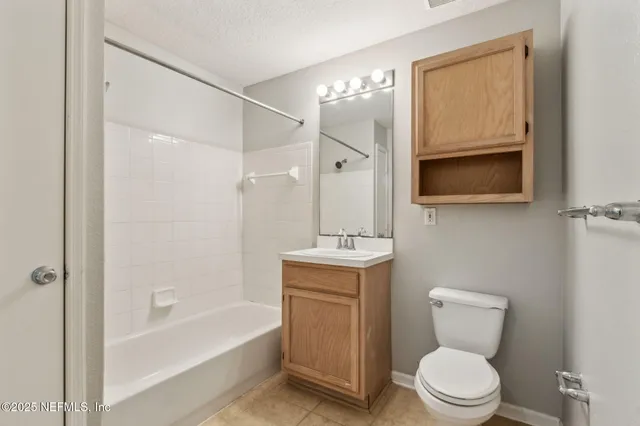 a view of a big room with closet and a chandelier fan