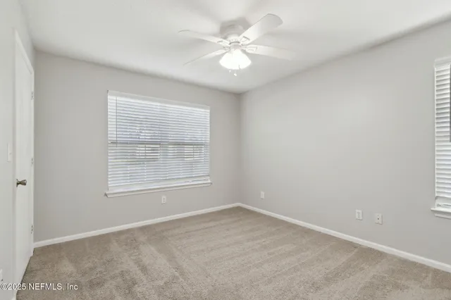 a bathroom with a sink toilet vanity and shower