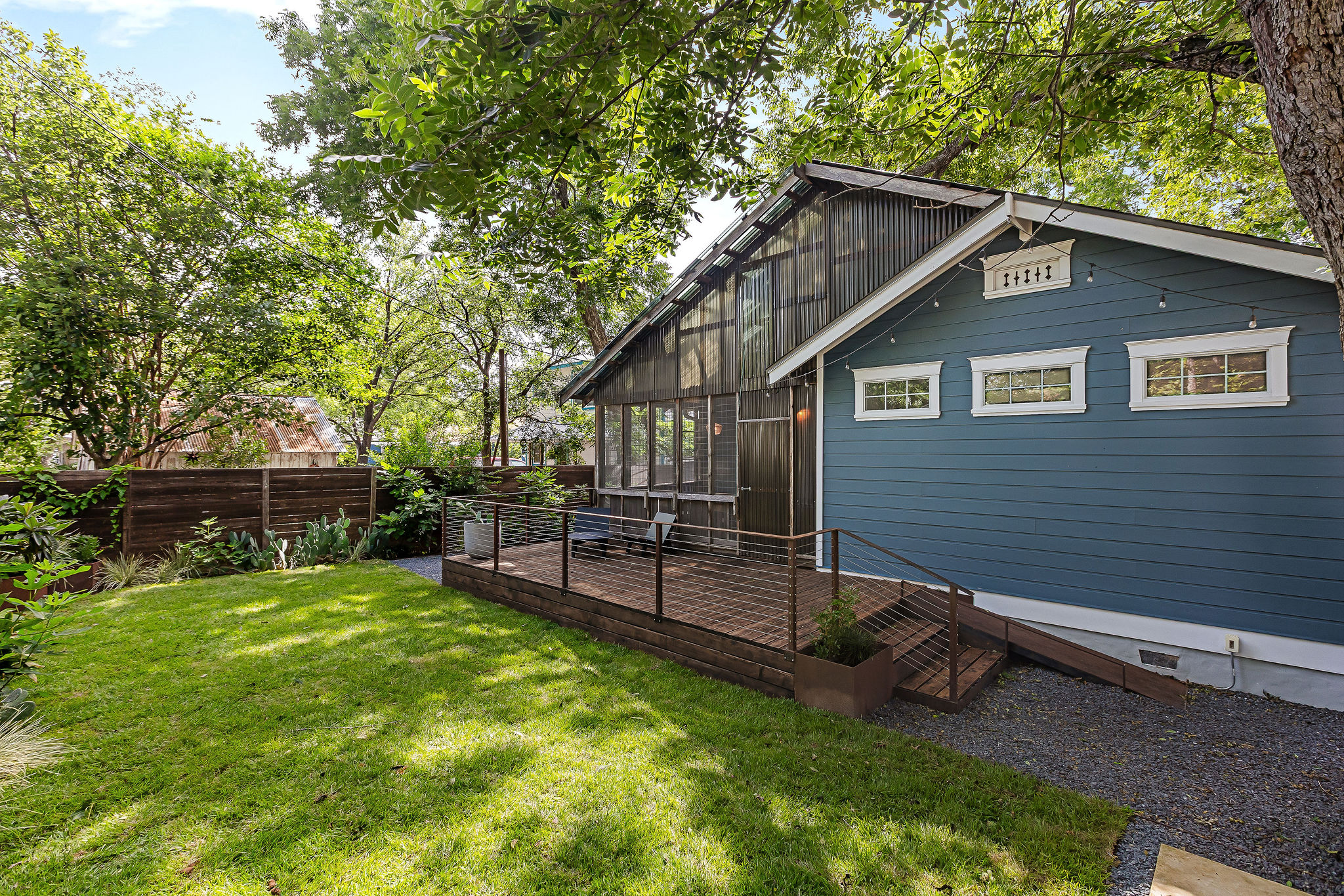 5108 Eilers Avenue Austin, TX 78751 - Photo 37 of 39 Spacious backyard with exterior deck and screened-in porch