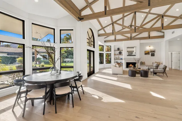 a living room with furniture tv and a fireplace