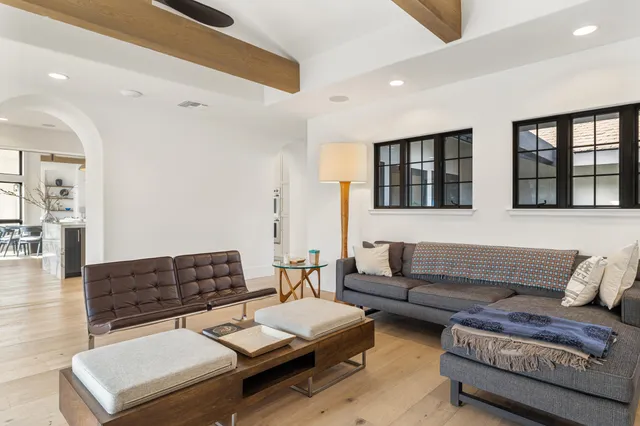 a bathroom with a tub sink and a mirror