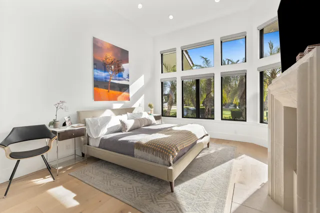 a bathroom with double vanity sinks and a mirror