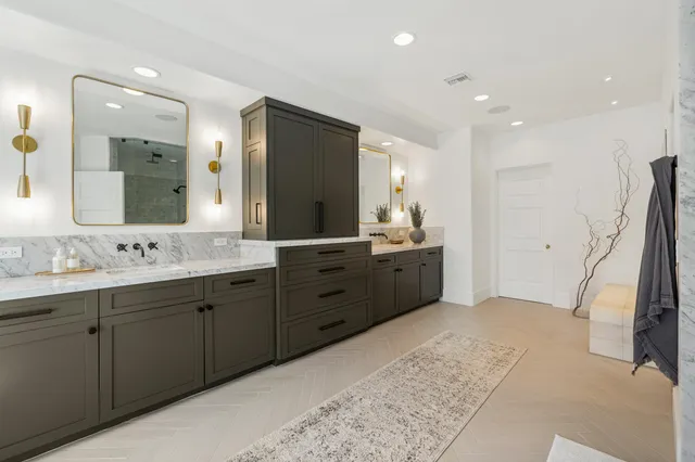 a utility room with sink dryer and washer