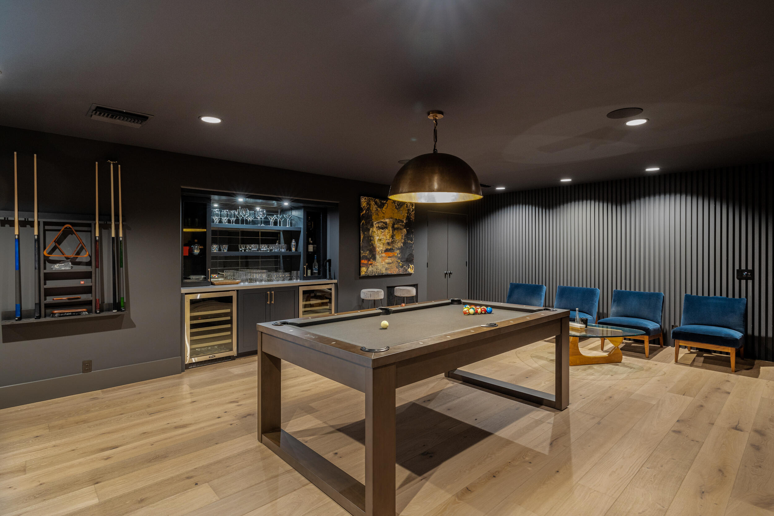 72420 Silver Spur Lane Rancho Mirage, CA 92270 - Photo 3 of 86 a kitchen with stainless steel appliances kitchen island granite countertop a stove a refrigerator a sink a dining table and chairs with wooden floor