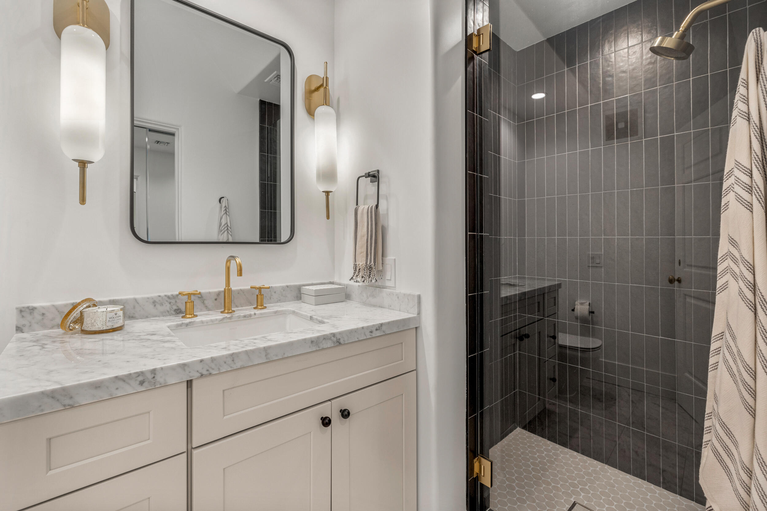 72420 Silver Spur Lane Rancho Mirage, CA 92270 - Photo 32 of 86 a bathroom with a granite countertop sink toilet and shower