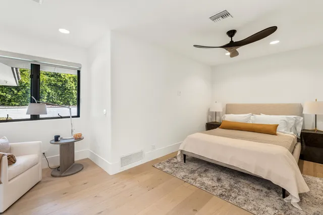 a view of a livingroom with furniture and a window