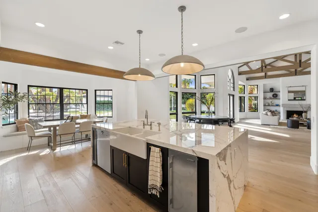 a bathroom with a granite countertop sink mirror and shower