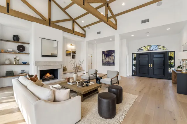 a view of a house with swimming pool and sitting area
