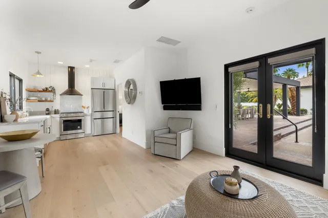 a view of a swimming pool with a table and chairs