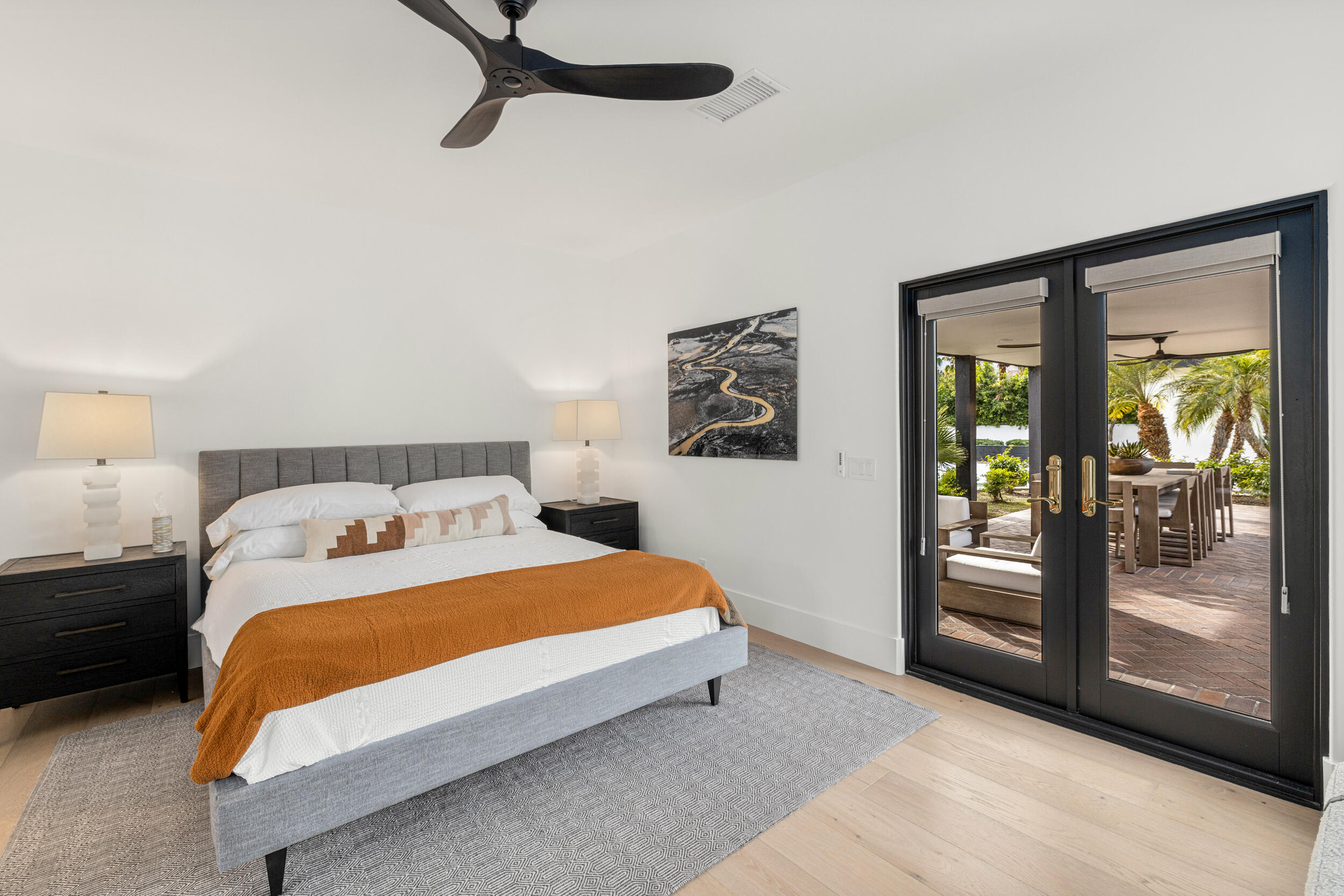 72420 Silver Spur Lane Rancho Mirage, CA 92270 - Photo 54 of 86 a bedroom with a bed and large mirror