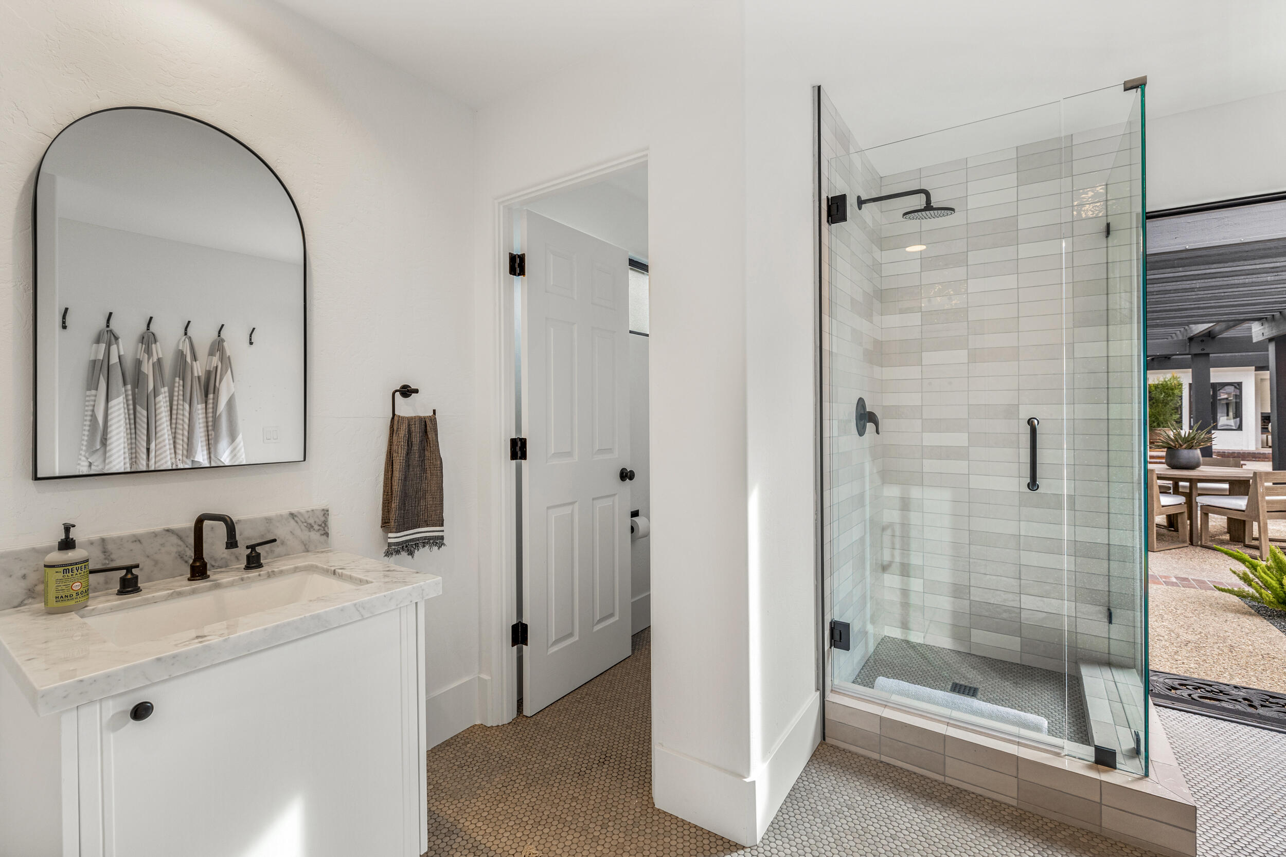 72420 Silver Spur Lane Rancho Mirage, CA 92270 - Photo 70 of 86 a bathroom with a granite countertop sink mirror and shower