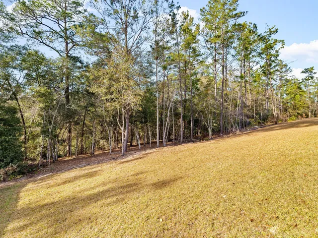 a large kitchen with granite countertop a sink and a granite counter tops