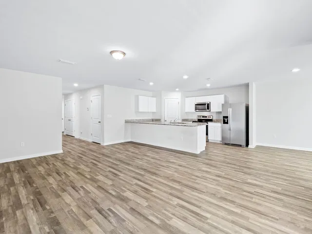 a view of balcony with wooden floor