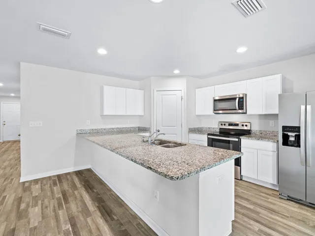 a view of large space with large trees