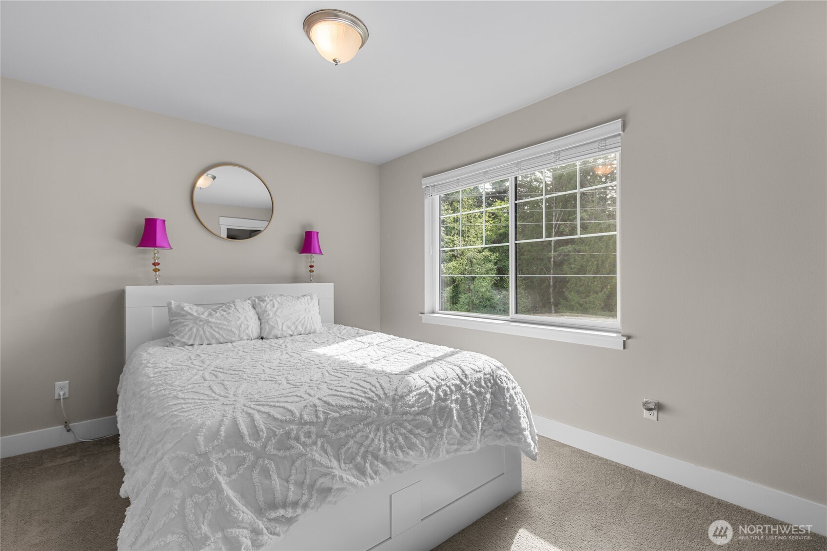 4612 186th Place Southeast, Unit A Bothell, WA 98012 - Photo 19 of 39 a bedroom with a bed and a large window