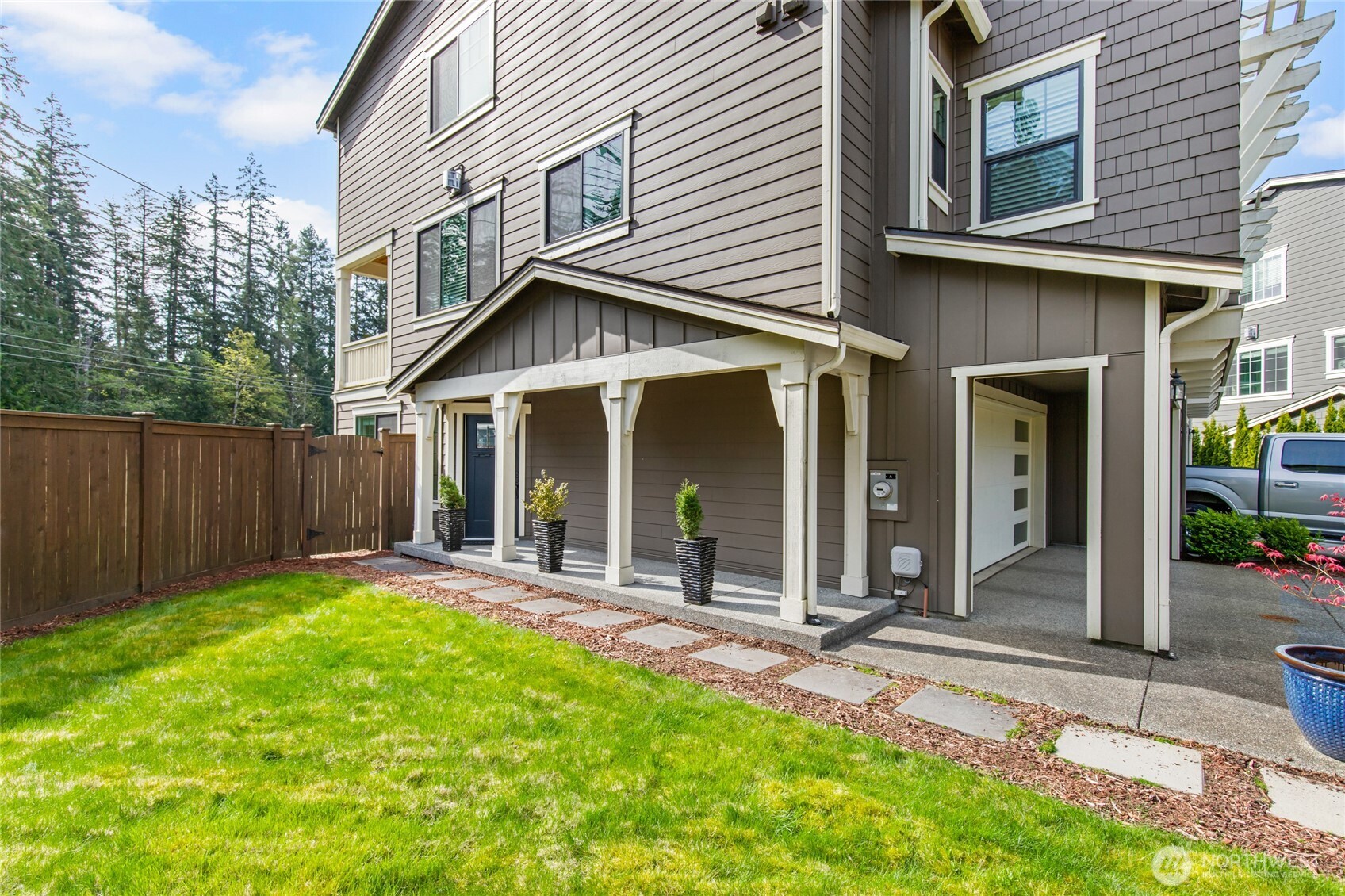 4612 186th Place Southeast, Unit A Bothell, WA 98012 - Photo 26 of 39 a view of a house with small yard and wooden fence