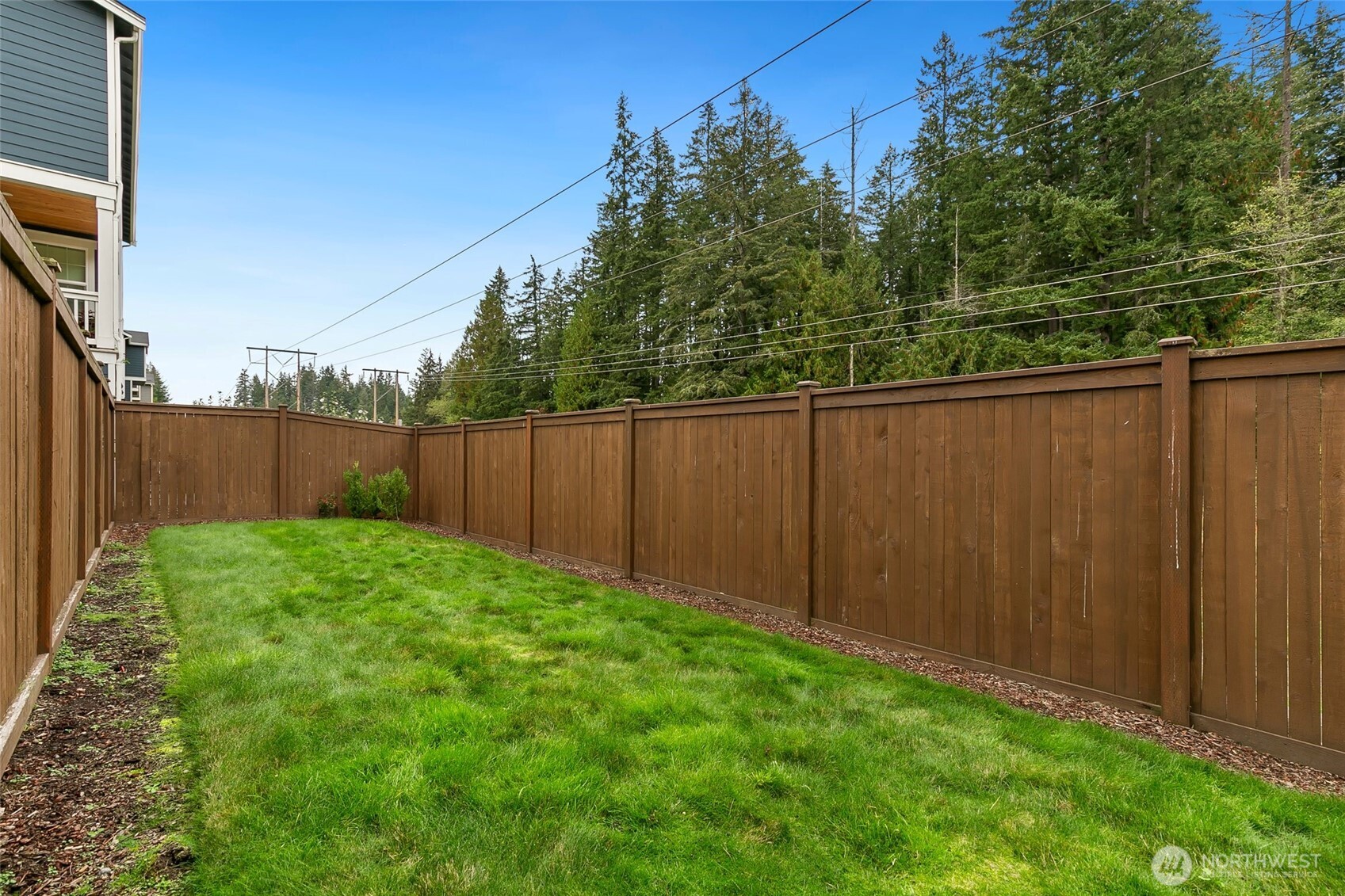 4612 186th Place Southeast, Unit A Bothell, WA 98012 - Photo 28 of 39 a view of backyard with wooden fence
