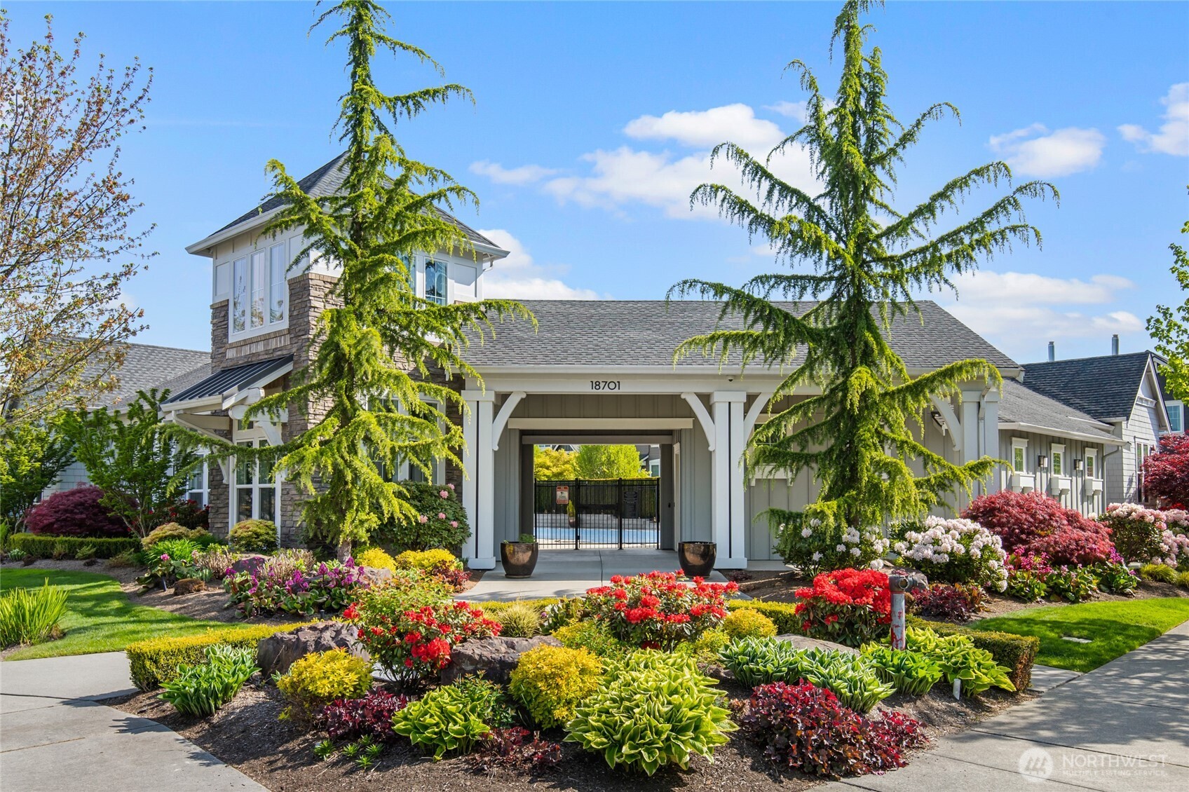 4612 186th Place Southeast, Unit A Bothell, WA 98012 - Photo 32 of 39 a front view of a house with a garden