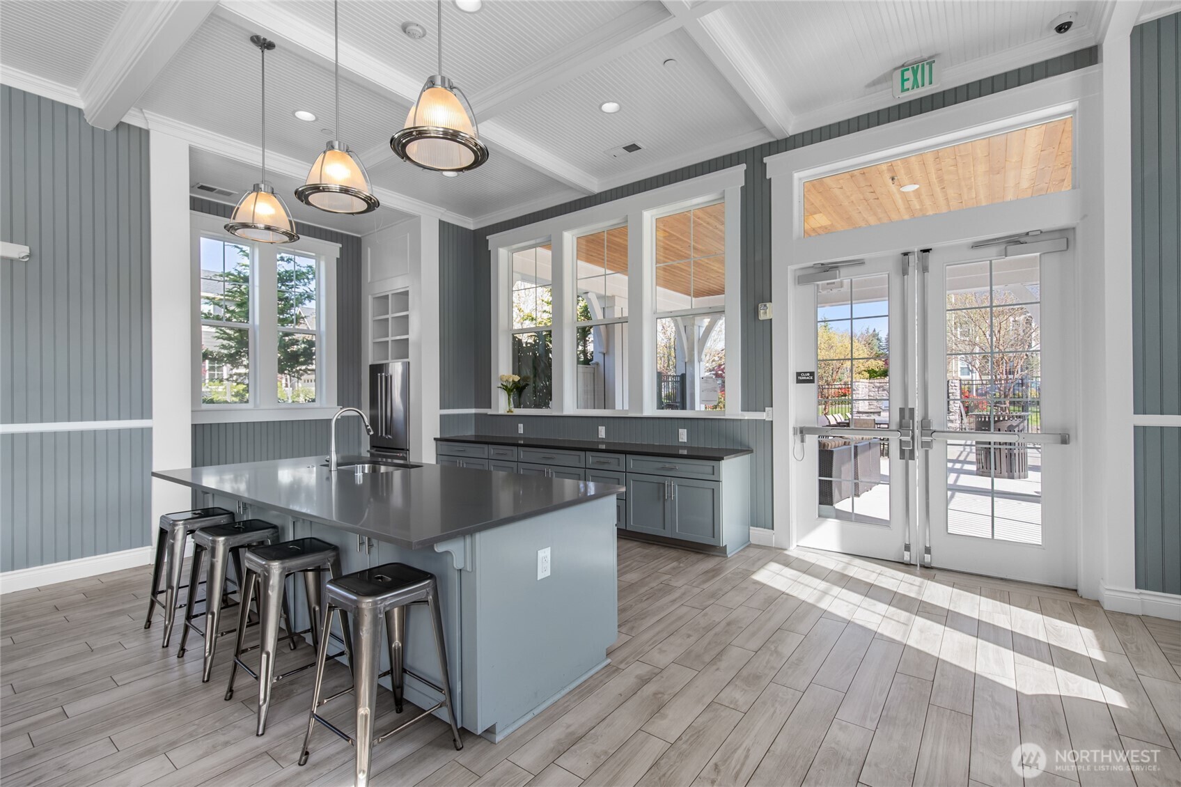 4612 186th Place Southeast, Unit A Bothell, WA 98012 - Photo 36 of 39 a view of a dining room with furniture a chandelier and wooden floor