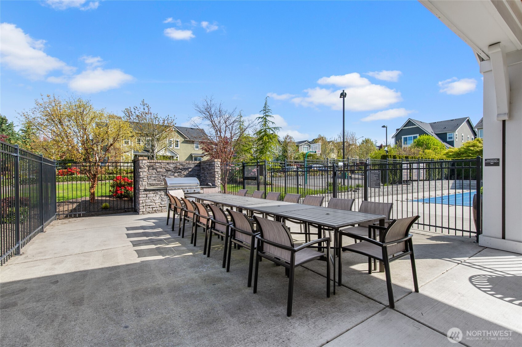 4612 186th Place Southeast, Unit A Bothell, WA 98012 - Photo 38 of 39 a view of a patio with a table and chairs