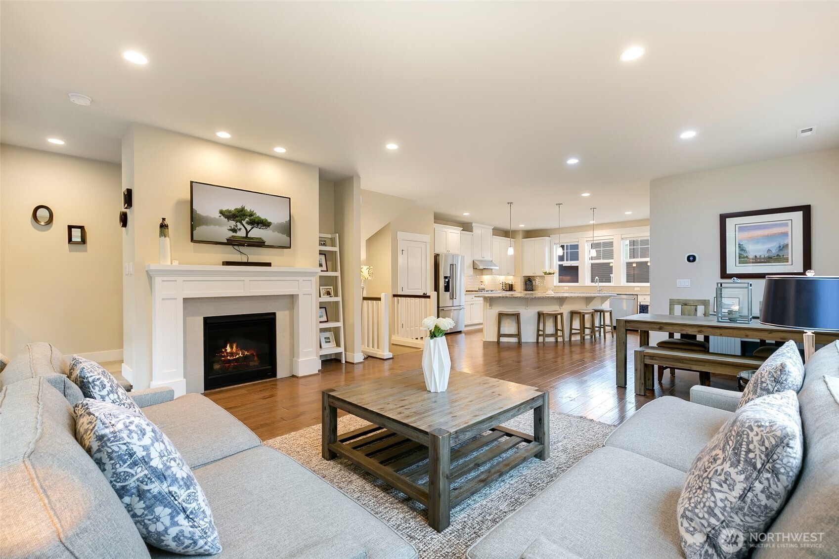 4612 186th Place Southeast, Unit A Bothell, WA 98012 - Photo 5 of 39 a living room with furniture a table and a fireplace
