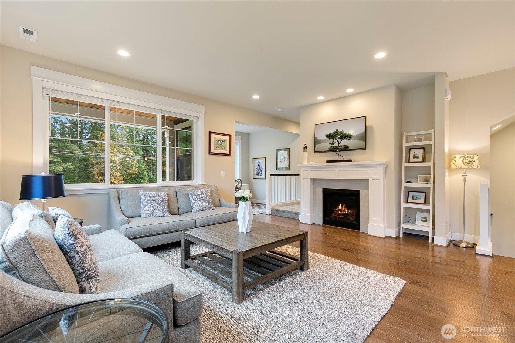 4612 186th Place Southeast, Unit A Bothell, WA 98012 - Photo 6 of 39 a living room with furniture and a fireplace