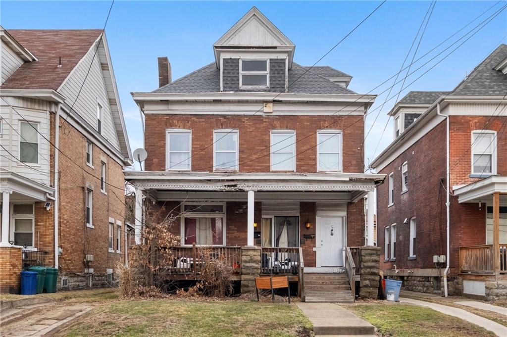 1708 Termon Avenue Pittsburgh, PA 15212 - Photo 1 of 20 a front view of a residential apartment building with a yard