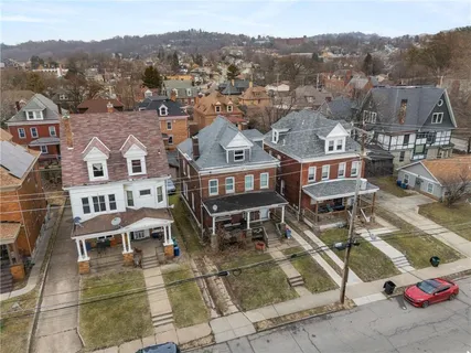 an aerial view of a house with a garden