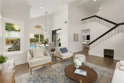 a living room with furniture or couch and a rug