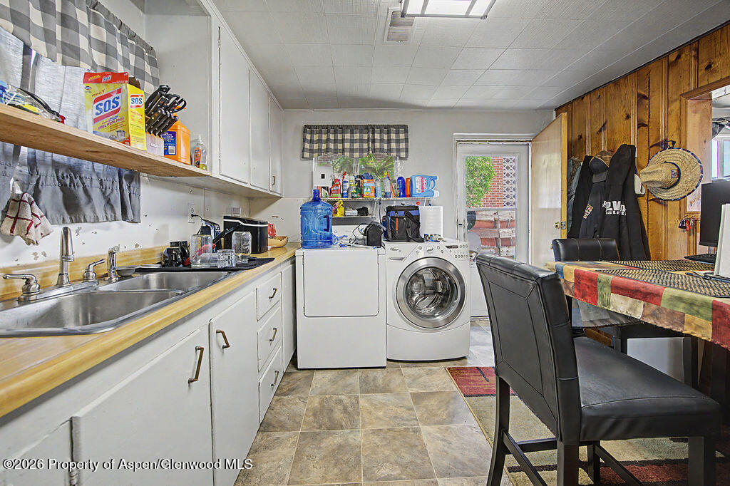 625 Russell Street Craig, CO 81625 - Photo 21 of 35 a utility room with multiple dryer and washer