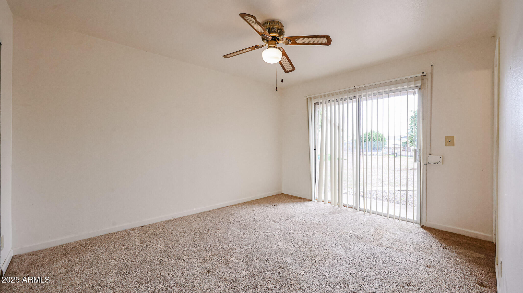 11851 North Thunderbird Road Sun City, AZ 85351 - Photo 26 of 46 a view of a livingroom with a ceiling fan and window