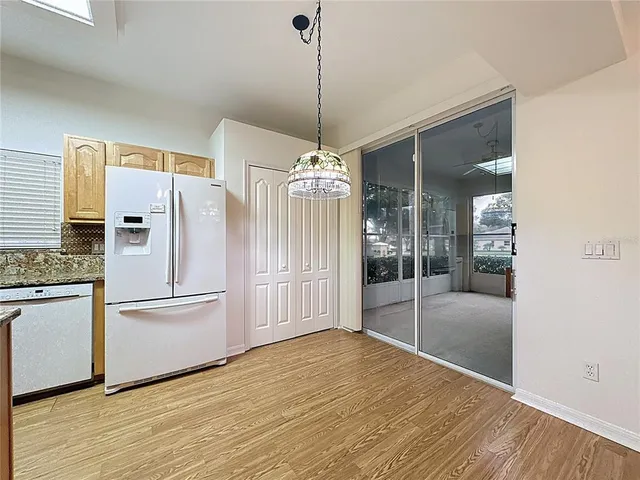 a spacious bathroom with a double vanity sink mirror and bathtub