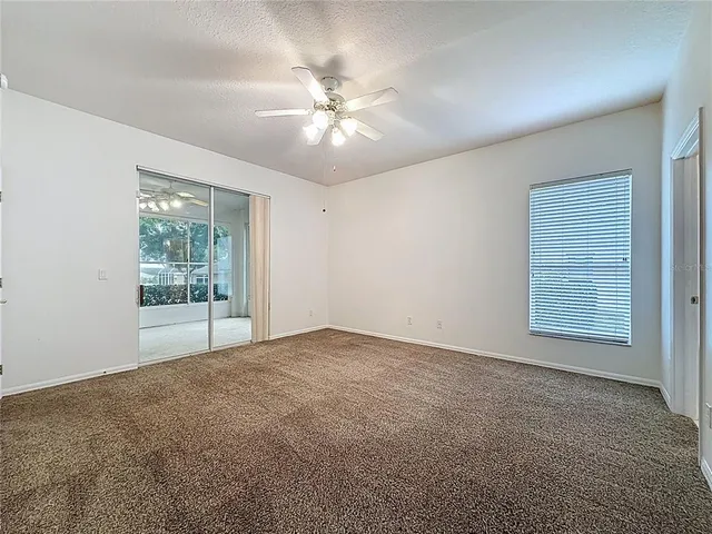 a bathroom with a shower sink and mirror