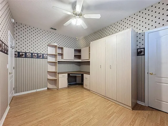 a front view of a house with a yard and street view