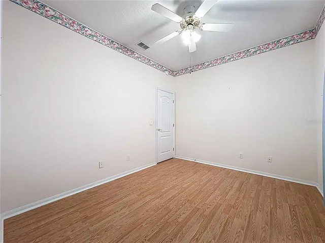 a living room with lots of furniture and a chandelier