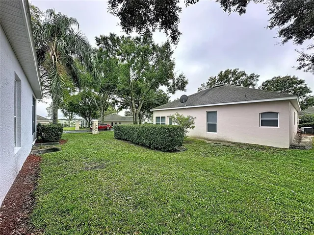 a large hall with stainless steel appliances granite countertop lots of wooden furniture