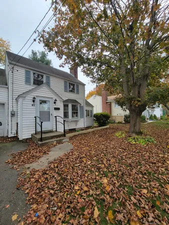 a backyard of a house with large trees