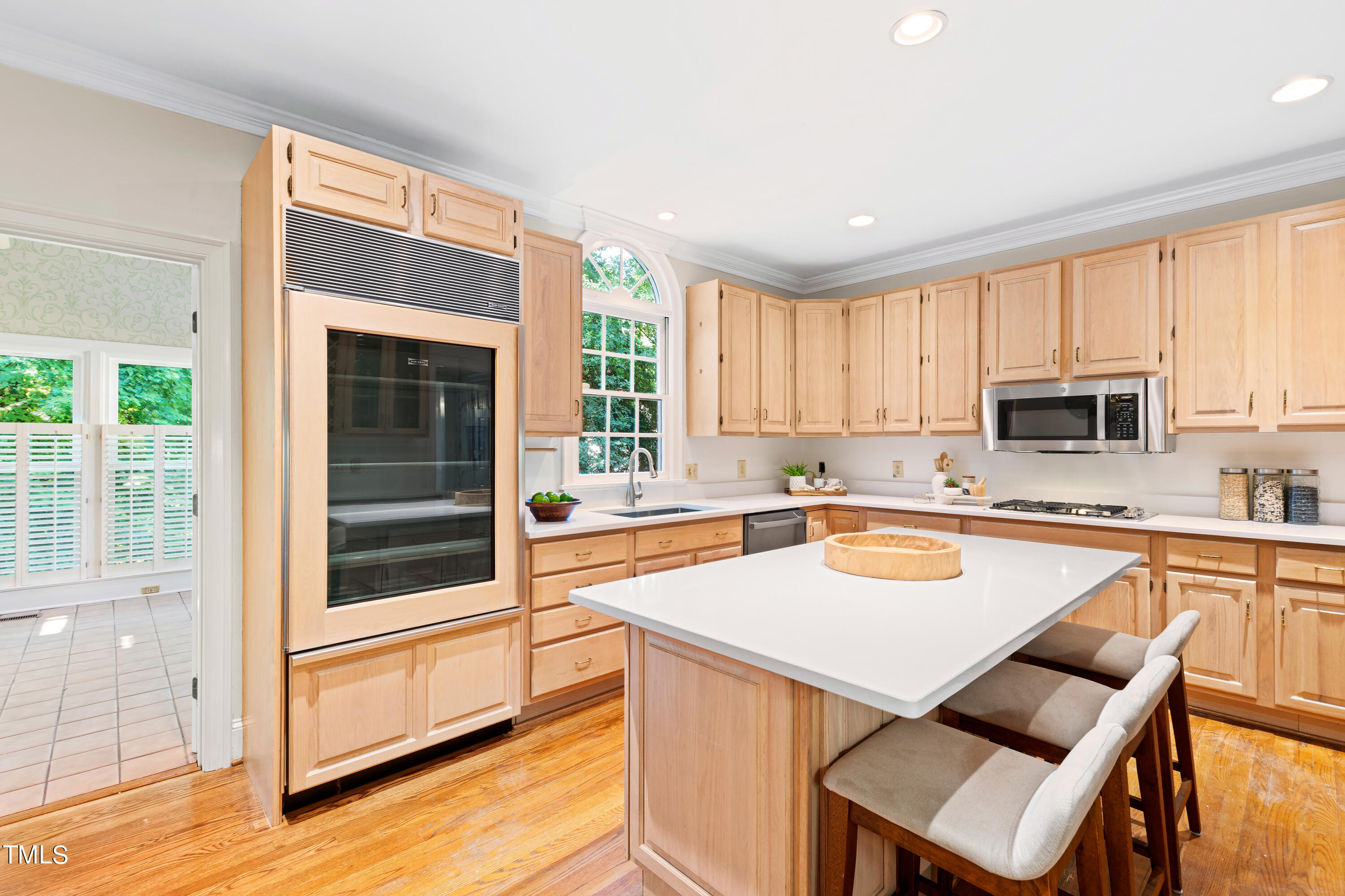 605 Chalfant Court Raleigh, NC 27607 - Photo 15 of 37 a kitchen with stainless steel appliances granite countertop a stove a sink and a microwave