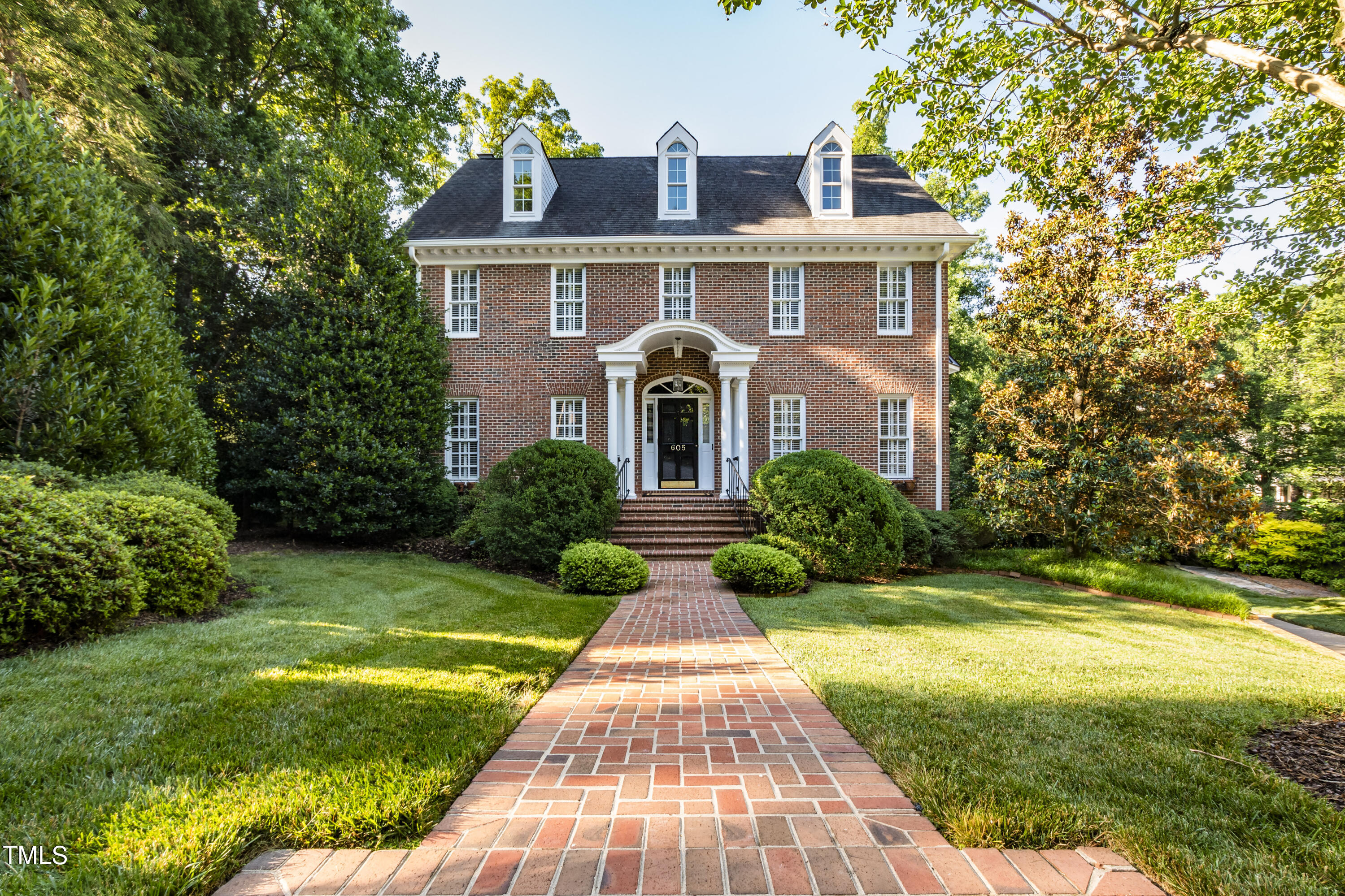 605 Chalfant Court Raleigh, NC 27607 - Photo 2 of 37 a front view of a house with garden