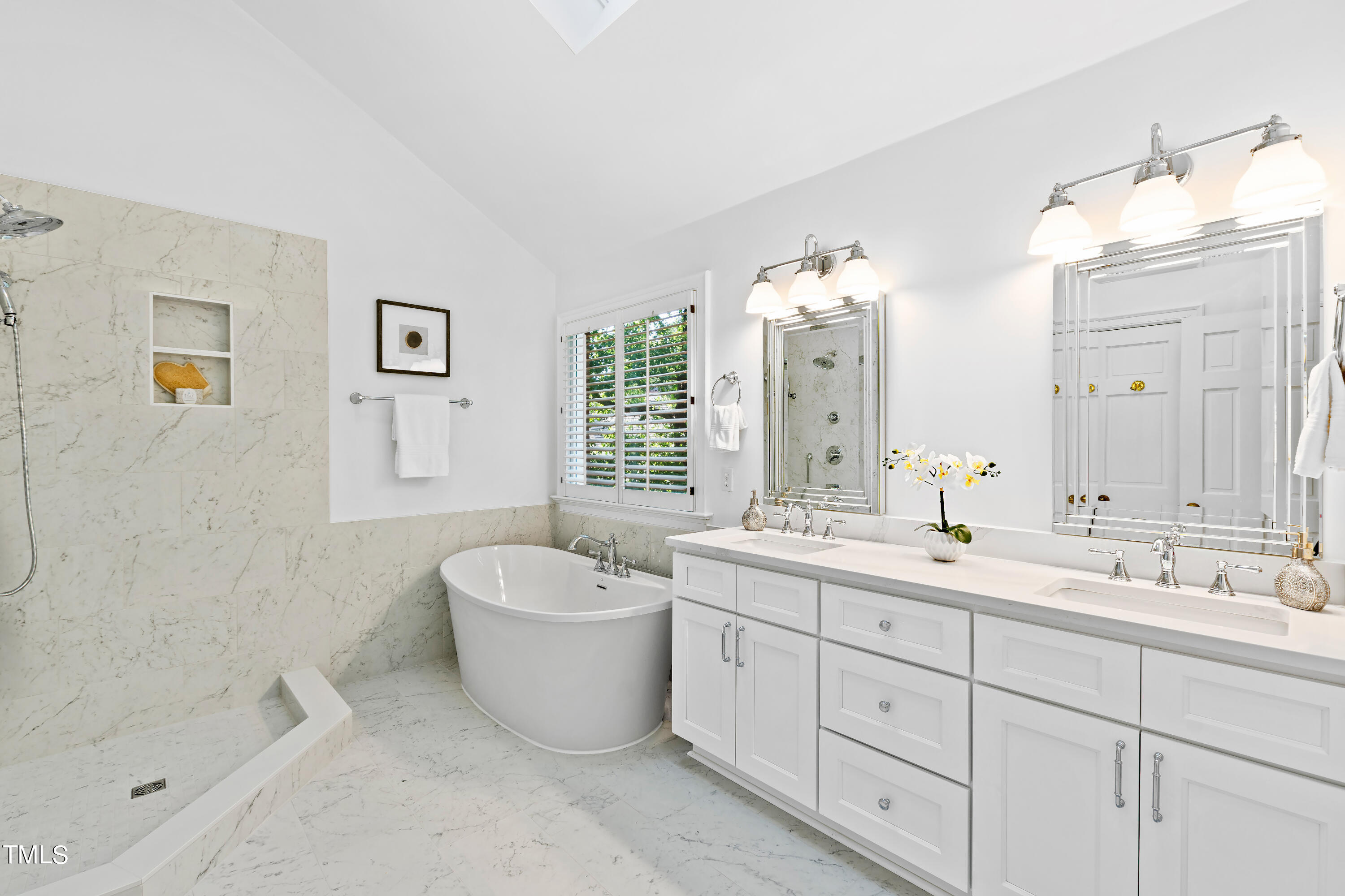 605 Chalfant Court Raleigh, NC 27607 - Photo 22 of 37 a spacious bathroom with a double vanity sink mirror and bathtub