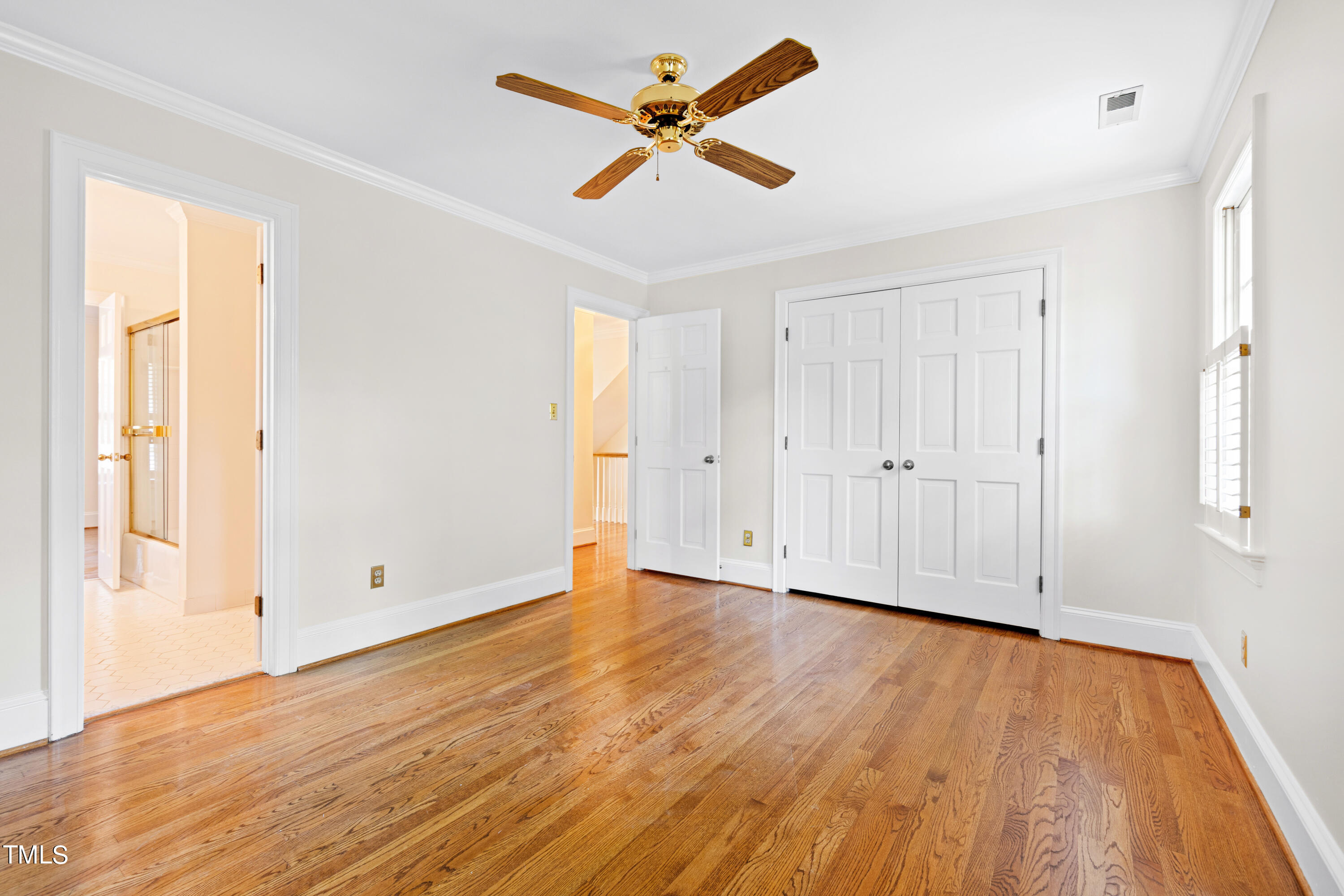 605 Chalfant Court Raleigh, NC 27607 - Photo 25 of 37 an empty room with wooden floor and windows