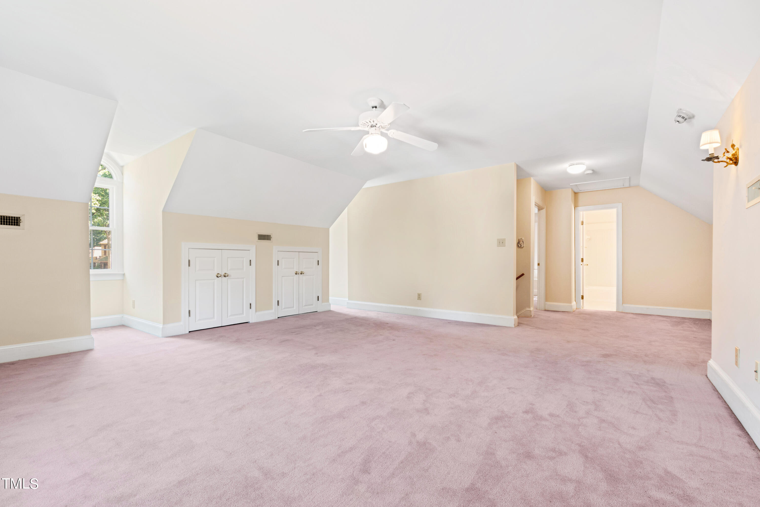 605 Chalfant Court Raleigh, NC 27607 - Photo 28 of 37 an empty room with an entryway and fan