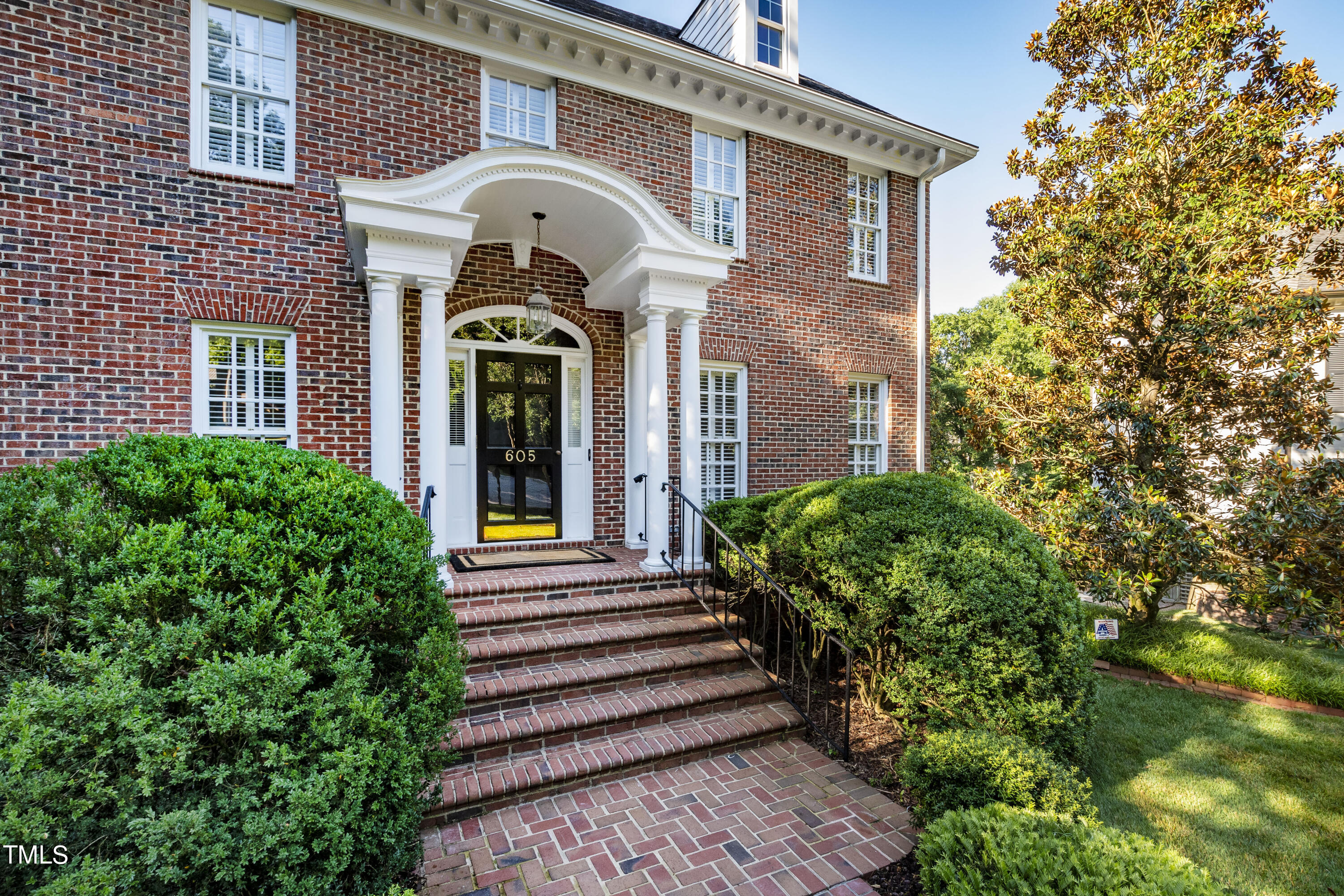 605 Chalfant Court Raleigh, NC 27607 - Photo 3 of 37 a front view of a house with a garden