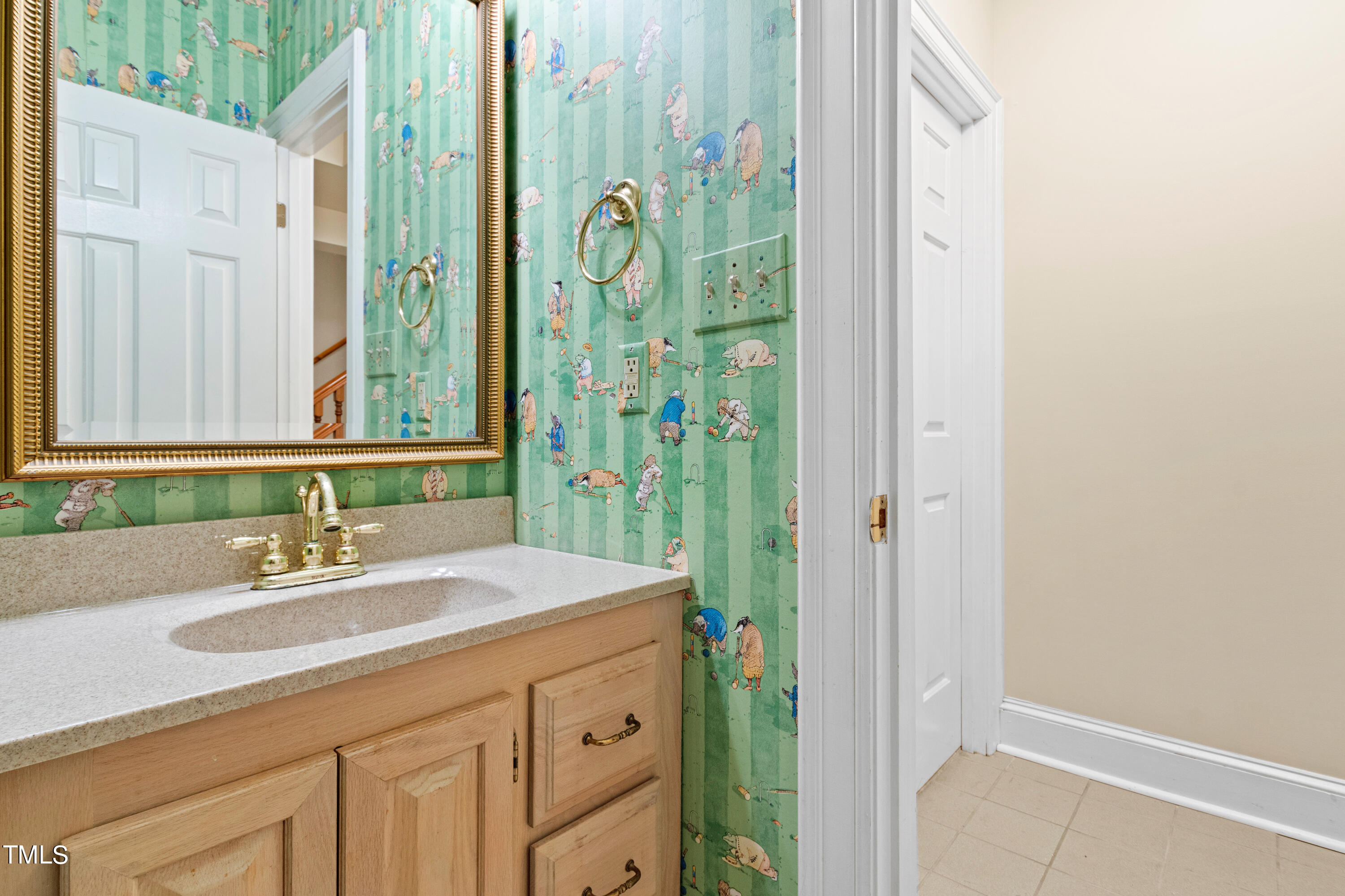 605 Chalfant Court Raleigh, NC 27607 - Photo 32 of 37 a bathroom with a sink and a mirror