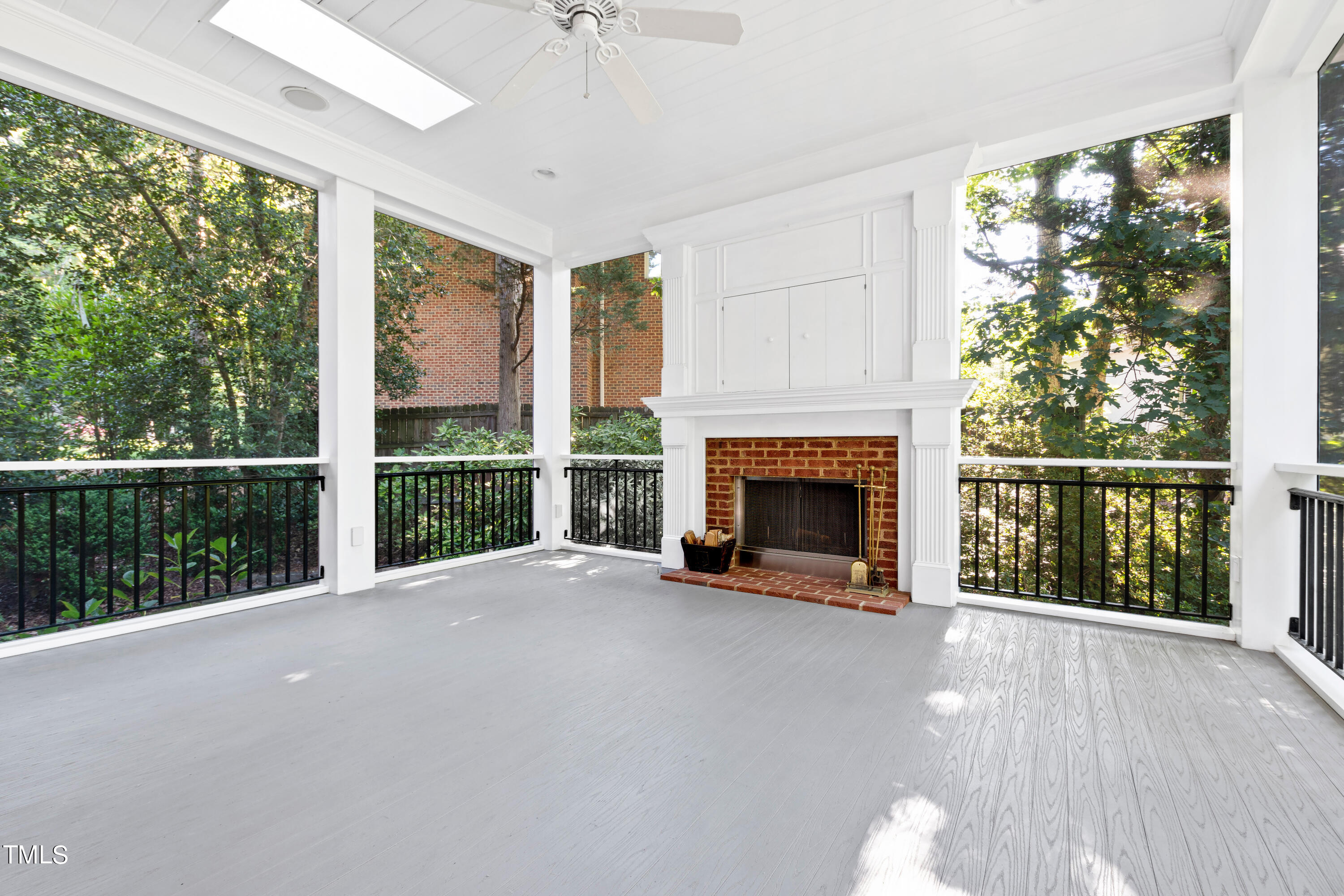 605 Chalfant Court Raleigh, NC 27607 - Photo 34 of 37 a view of an empty room with a fireplace and a window