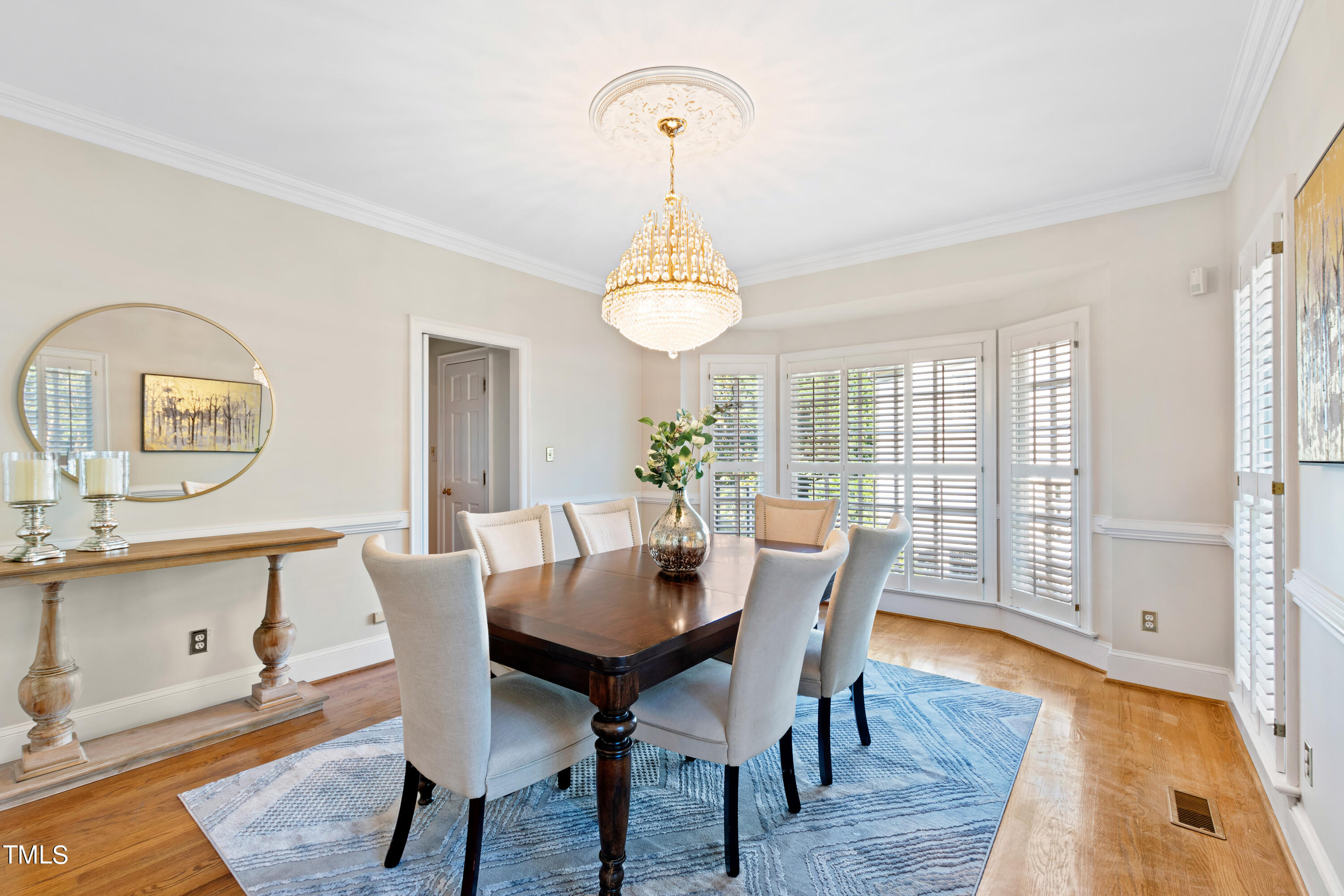 605 Chalfant Court Raleigh, NC 27607 - Photo 8 of 37 a view of a dining room with furniture window and wooden floor