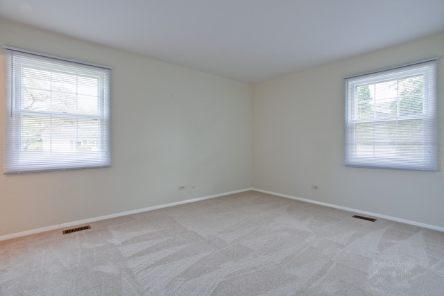 228 Timber Hill Road Buffalo Grove, IL 60089 - Photo 14 of 25 an empty room with a window