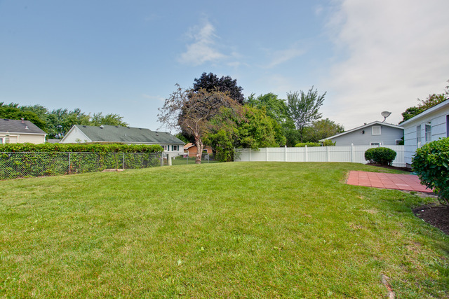 228 Timber Hill Road Buffalo Grove, IL 60089 - Photo 23 of 25 a view of yard with swimming pool and green space