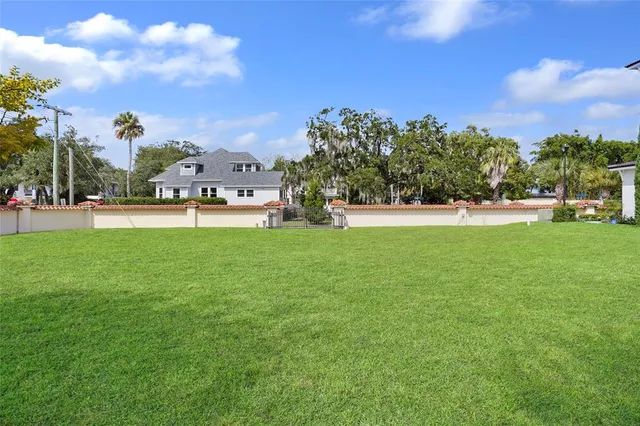 a view of a park with large trees