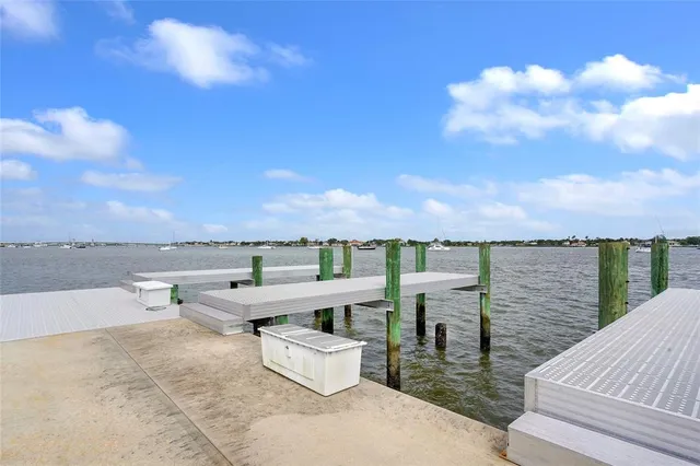 a view of roof deck with a barbeque and seating space